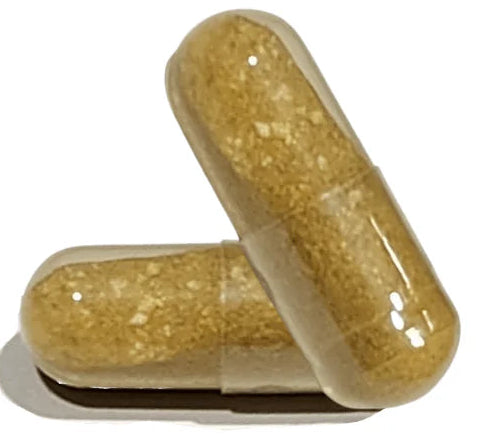 Two gold-colored capsules on a white background