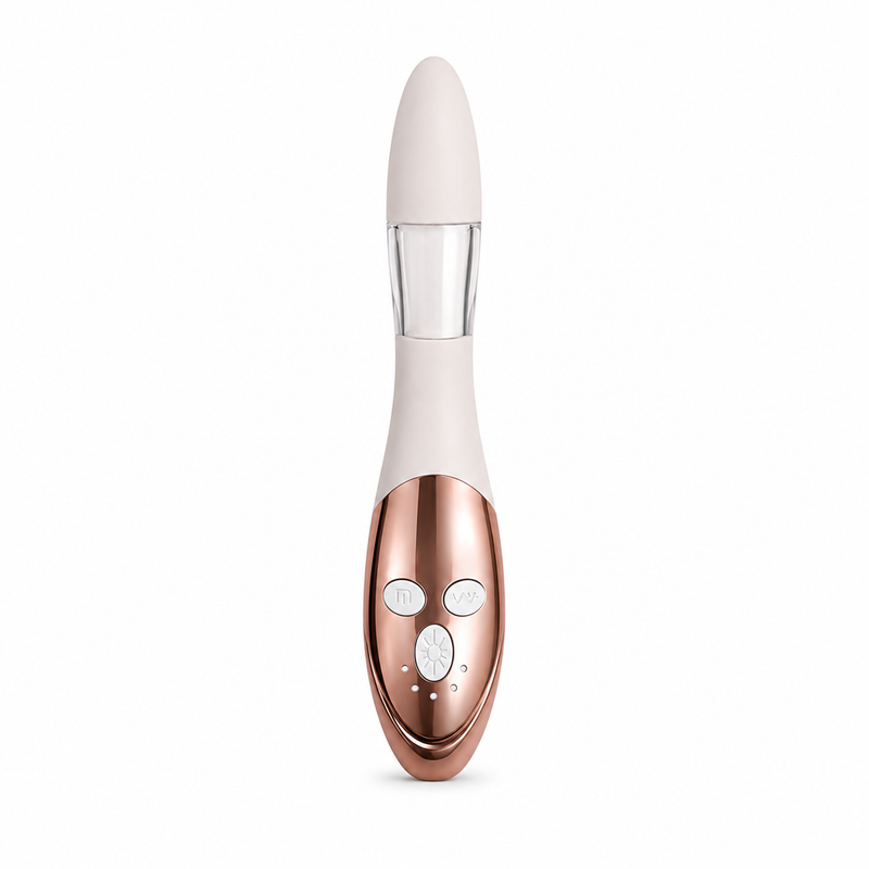A sleek personal massager with a rose gold metallic body, a cream-colored upper section, and a clear neck, shown against a plain white background.