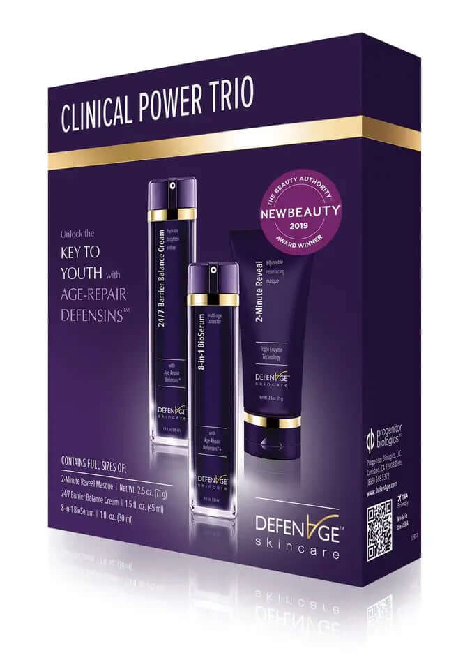 DefenAge Clinical Power Trio box shows anti-aging set with BioSerum, Barrier Balance Cream and 2 Minute Reveal Masque kit go