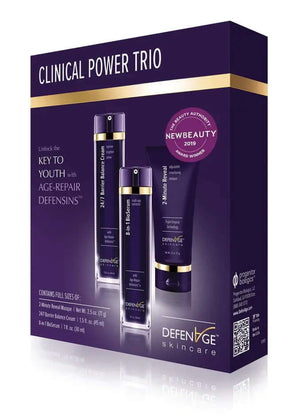 DefenAge Clinical Power Trio box shows anti-aging set with BioSerum, Barrier Balance Cream and 2 Minute Reveal Masque kit go