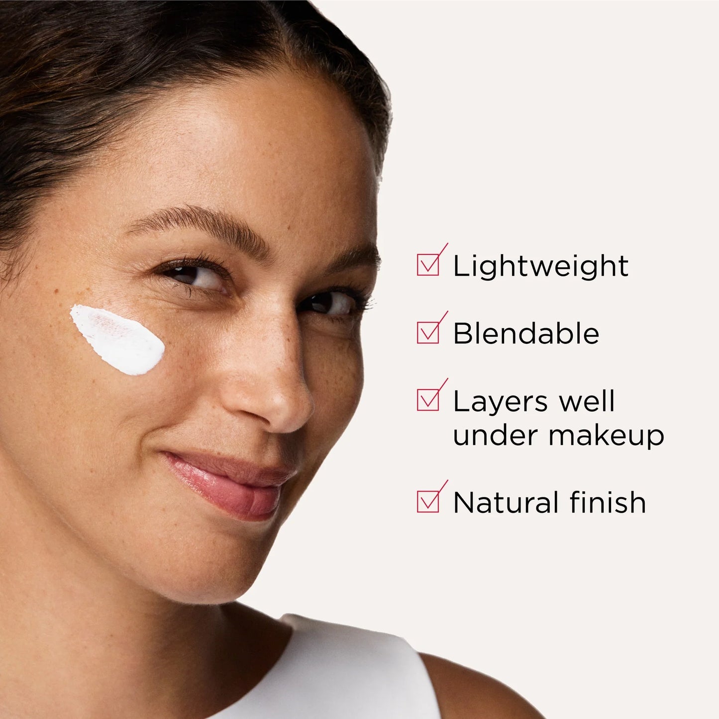 Model wearing EltaMD UV Hydration+ SPF 50 with lightweight blendable texture that layers well under makeup smoothly.