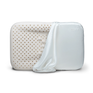 enVy anti-aging ergonomic pillow with natural latex core and copper-infused white silk pillowcase partially removed