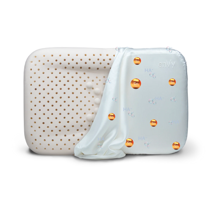 enVy pillow silk pillowcase pulled back revealing copper ion and hyaluronic acid bio-infusion technology inside the fabric