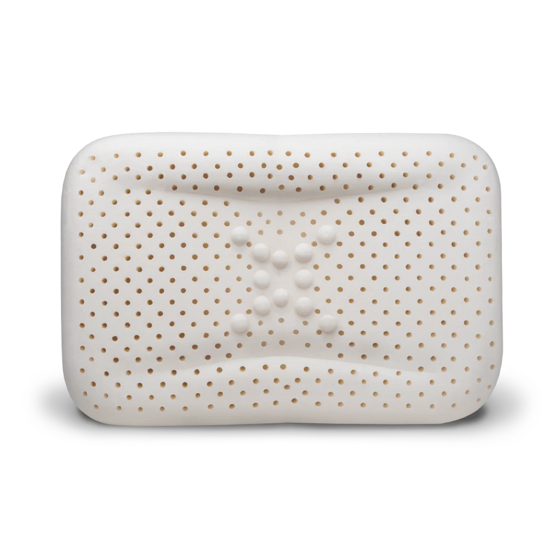 Close-up of enVy ergonomic pillow 100% natural latex core showing ventilation holes and dual-density neck support bumps