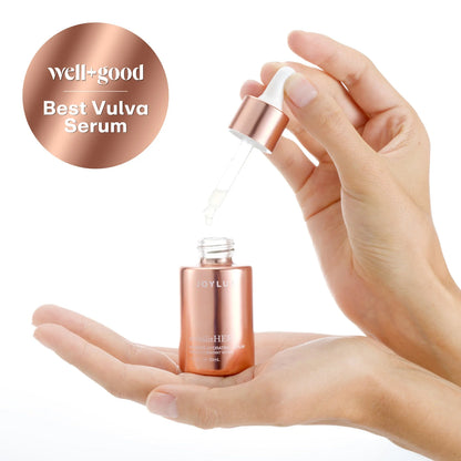 Joylux Revitalize-HER dropper serum shown in hands with Best Vulva Serum award badge for dry intimate skin care