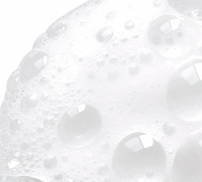 NazarianSkin Clear 1 foaming cleanser texture showing exfoliating bubbles with glycolic acid and salicylic acid.