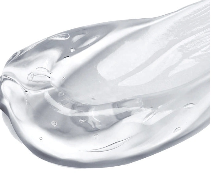 Close-up texture of NazarianSkin Lip Boost hydrating serum showing smooth glossy formula designed to plump lips