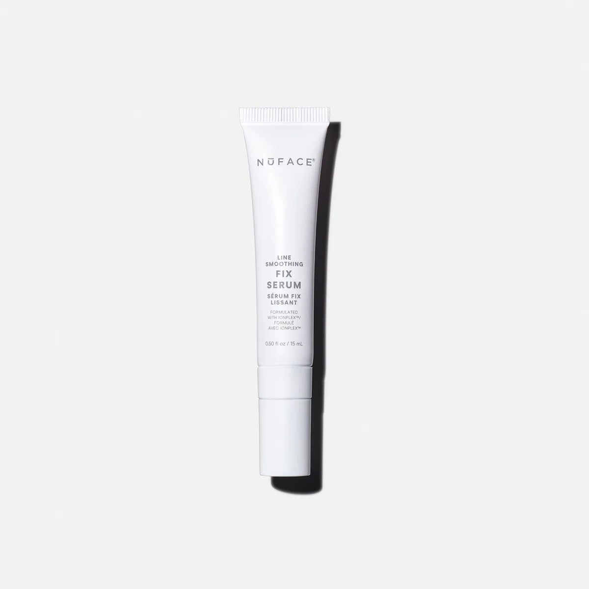 NuFACE FIX Serum white tube with IonPlex, hyaluronic acid, and peptides for smoothing expression lines and brightening skin.