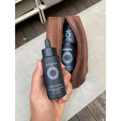 Nutrafol Hair Growth Serum travel pouch shows men's serum bottle with ashwagandha exosomes for daily scalp care support now.