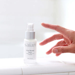 Saian Active Renewal Serum bottle on bathroom counter shows peptide and hyaluronic acid formula for daily skin renewal.