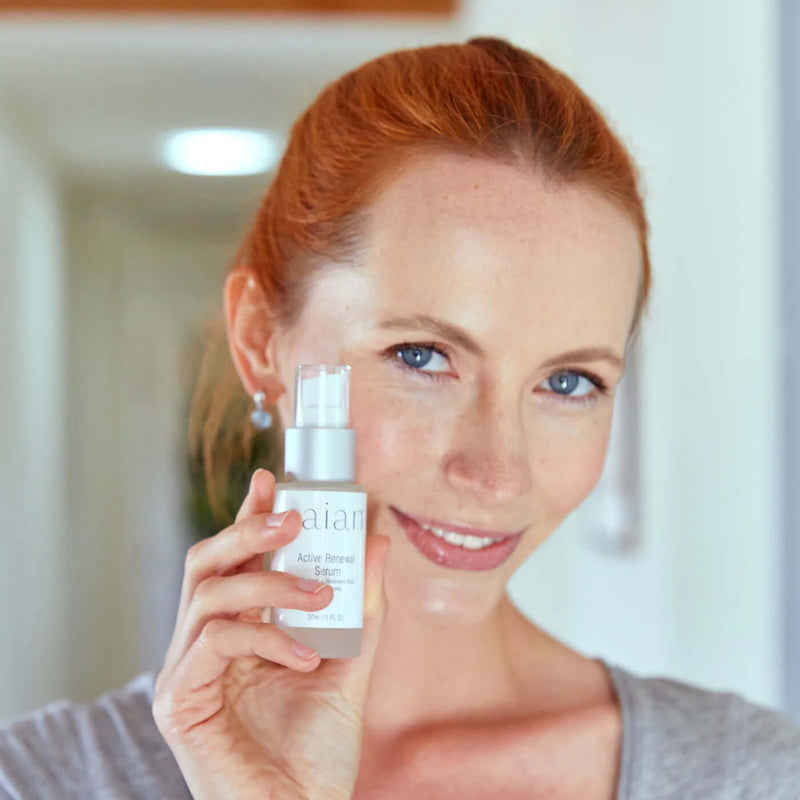 Saian Active Renewal Serum held near face highlights lightweight peptide serum for a smoother, hydrated-looking complexion.