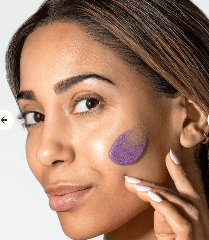 Woman applying Alastin ReSurface Skin Polish exfoliating face polish by Alastin Skincare for smooth glowing skin