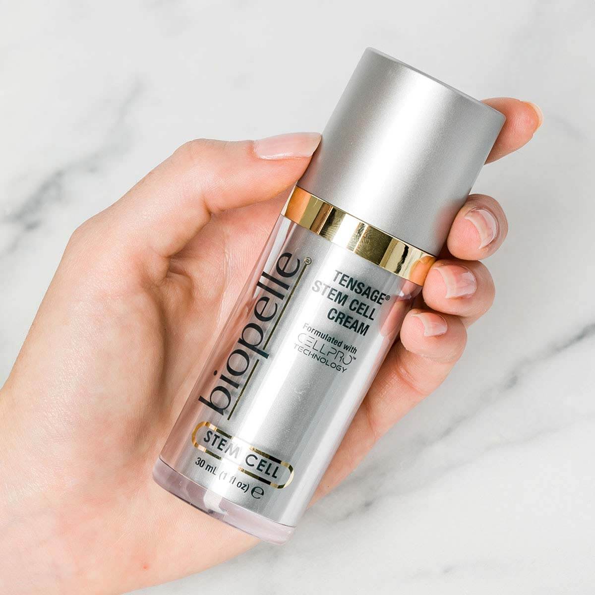 Biopelle Tensage Stem Cell Cream held in hand with CellPro, retinol and peptides for wrinkles, firmness, smooth texture use.
