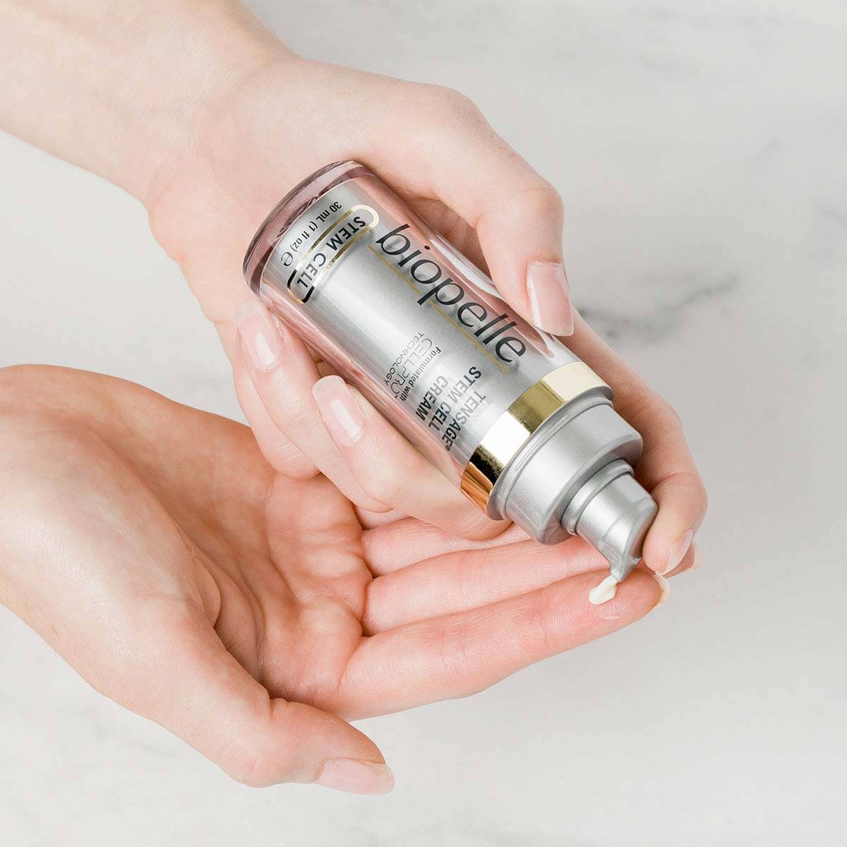 Biopelle Tensage Stem Cell Cream pump dispenses texture into hands with CellPro, retinol and peptides for nightly face care.