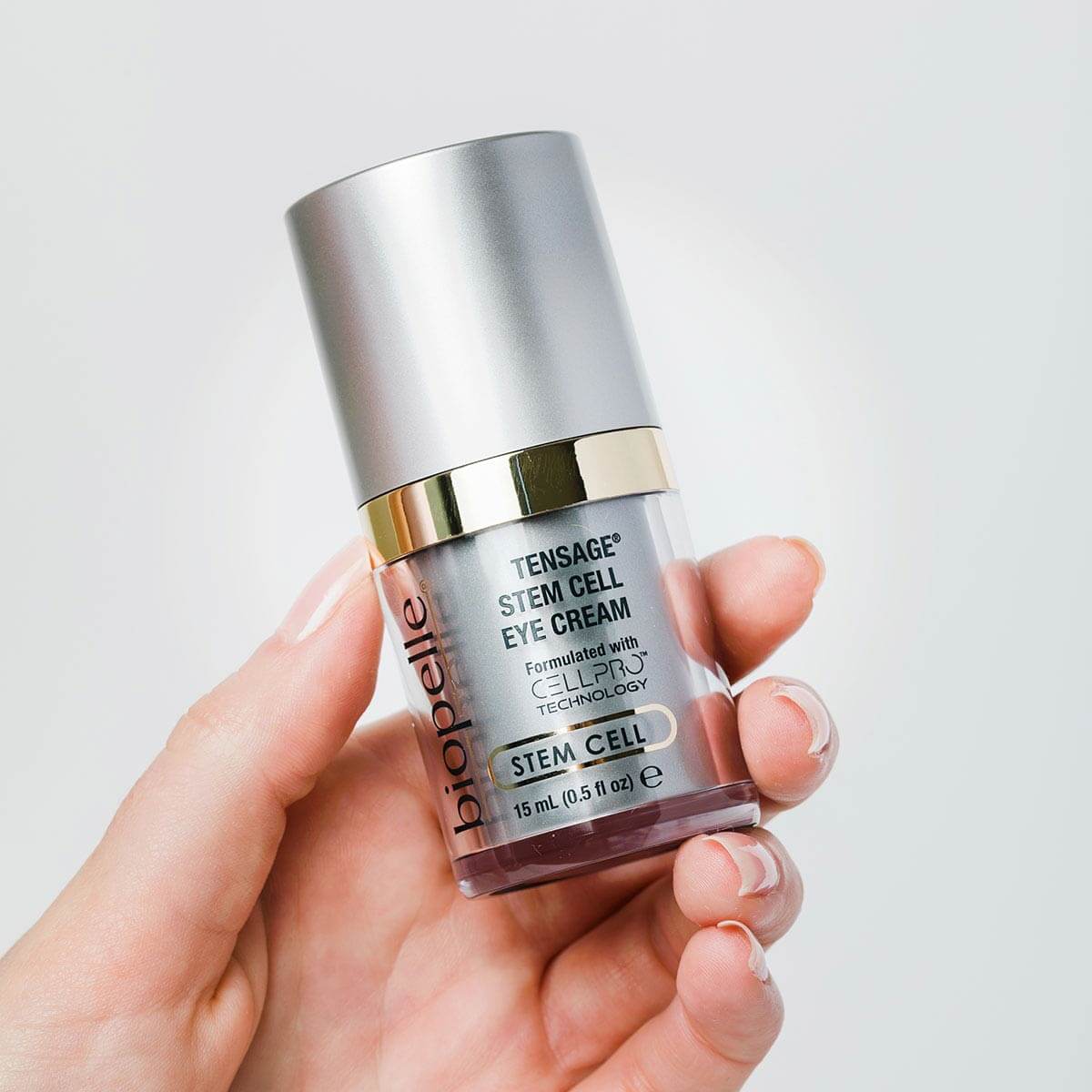 Biopelle Tensage Stem Cell Eye Cream held in hand with CellPro, retinol and caffeine for under eye puffiness and fine lines.
