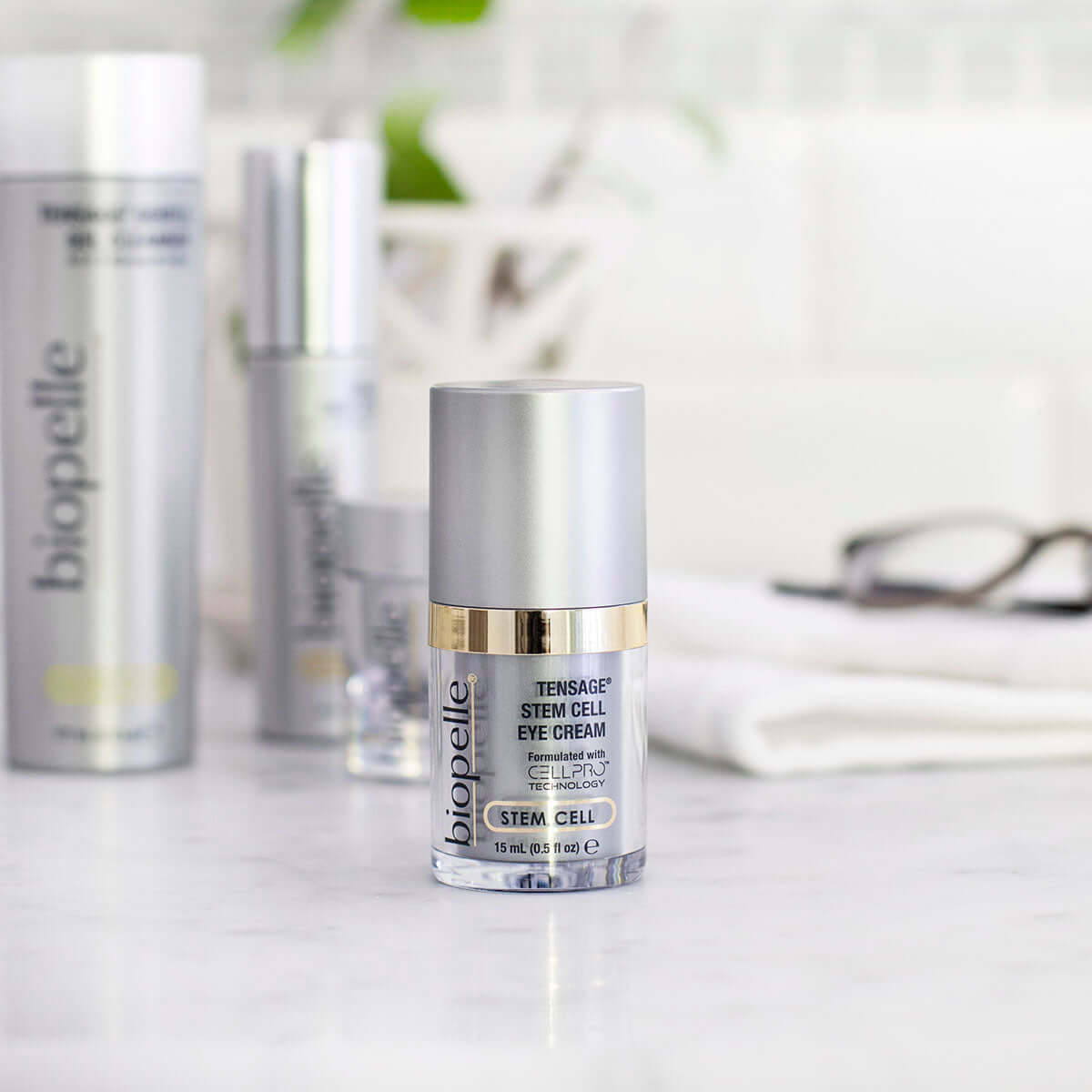 Biopelle Tensage Stem Cell Eye Cream bottle with CellPro, retinol, caffeine on vanity for puffiness and fine lines near eye.