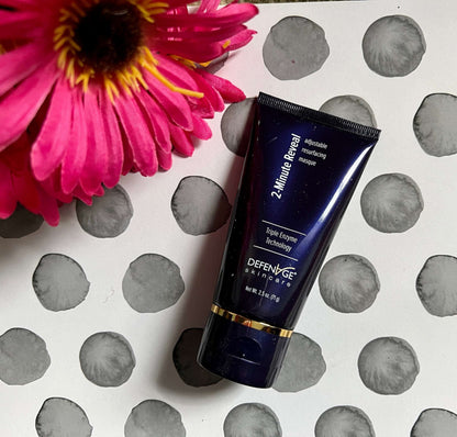 DefenAge 2 Minute Reveal Masque tube with pink flower and patterned surface for Triple Enzyme resurfacing and brighter skin.