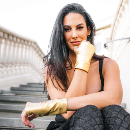 Woman wearing gold hand love gloves SPF50 UV protection gloves for sun protection preventing hand aging and sun damage