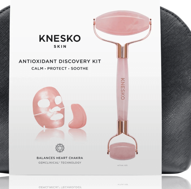 Knesko Skin Travel Kit Antioxidant Discovery Kit with pink facial roller, collagen face and eye masks displayed clearly now.