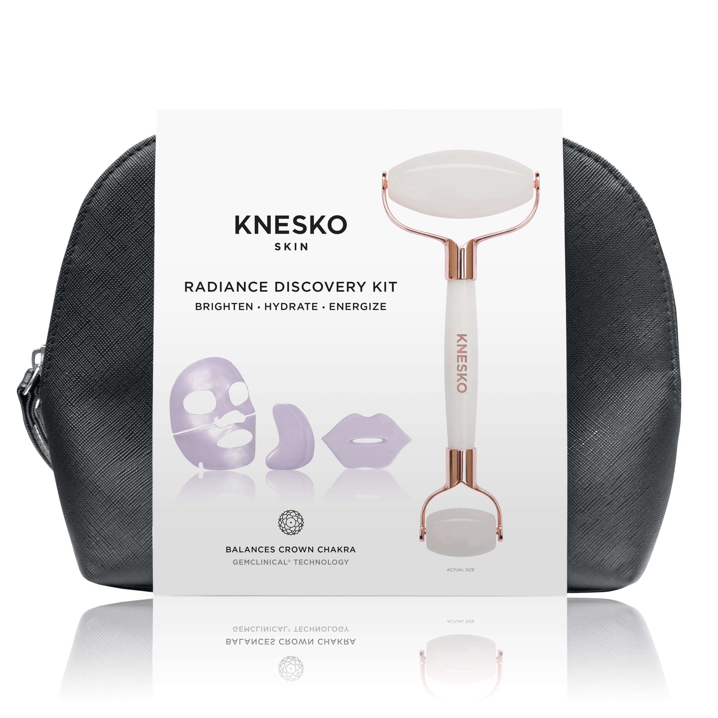 Knesko Skin Travel Kit Radiance Discovery Kit with white facial roller, collagen masks, and black travel bag shown in front.