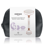 Knesko Skin Travel Kit Radiance Discovery Kit with white facial roller, collagen masks, and black travel bag shown in front.