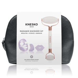 Knesko Skin Travel Kit Radiance Discovery Kit with white facial roller, collagen masks, and black travel bag shown in front.