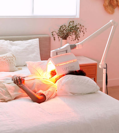 LightStim ProPanel Anti-Aging Light used at home on face and neck for red LED anti-aging skin therapy session care glow use.