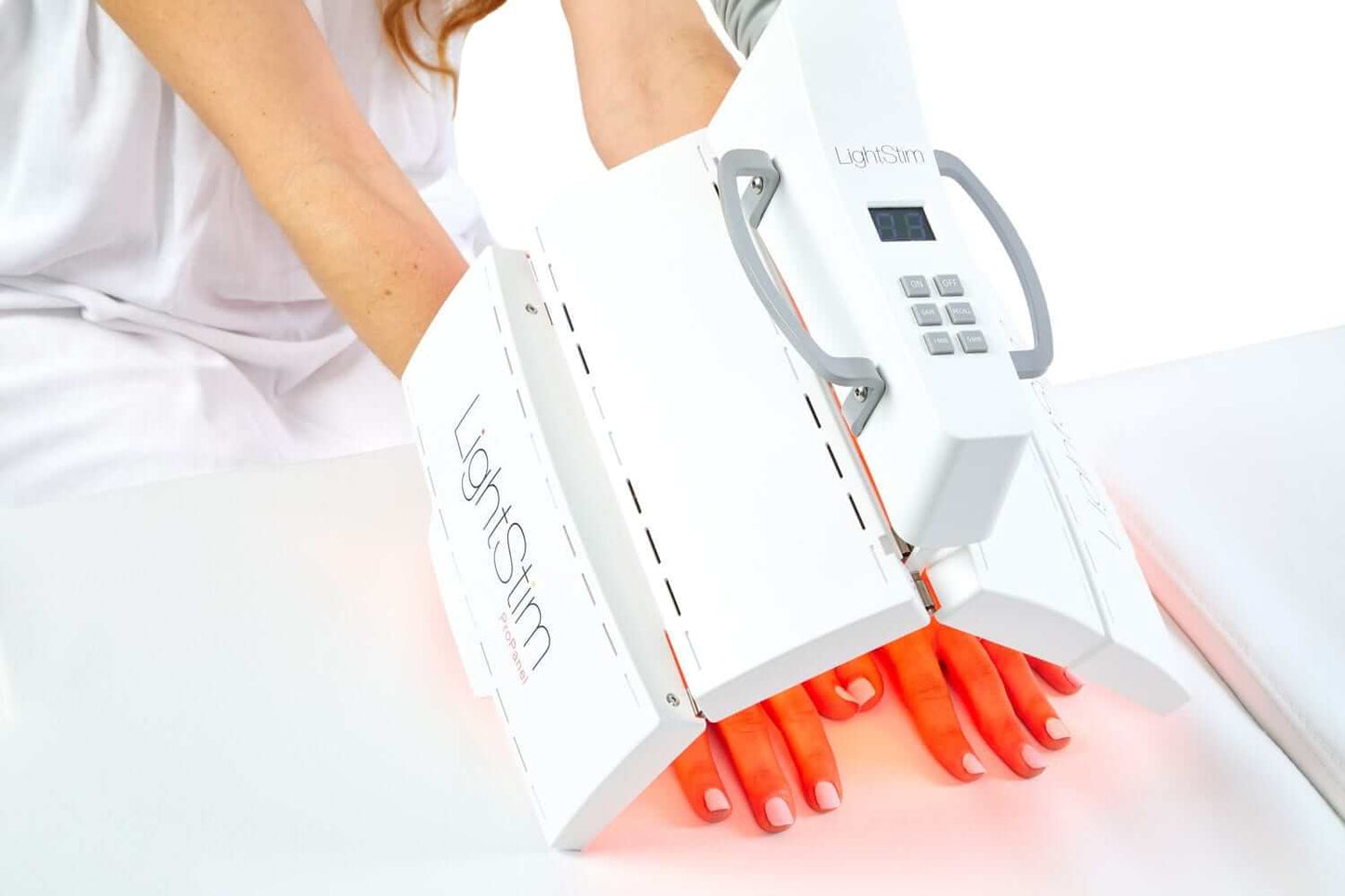 LightStim ProPanel Anti-Aging Light treating hands with red LED therapy to support smoother brighter looking skin glow care.