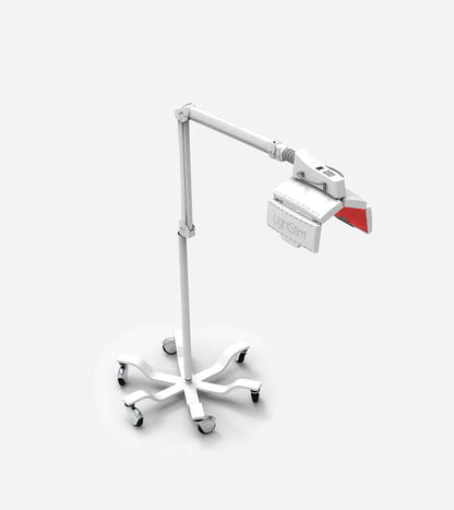 LightStim ProPanel anti aging light therapy device on rolling stand for professional red light treatments in treatment room.