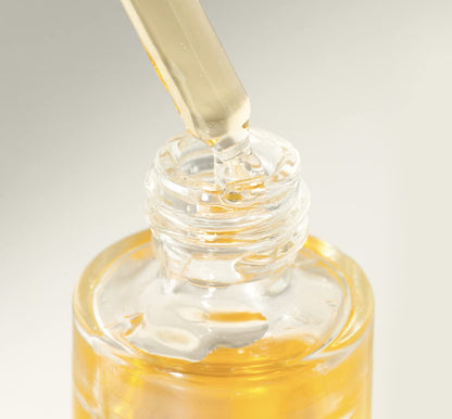 Lumity facial oil dropper in bottle close-up showing golden nutrient-rich oil for soft hydrated radiant skin daily care uses