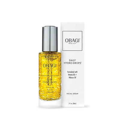 Obagi Daily Hydro-Drops serum and box show Vitamin B3, Hibiscus oil, and Abyssinian oil for radiant hydration and glow uses.