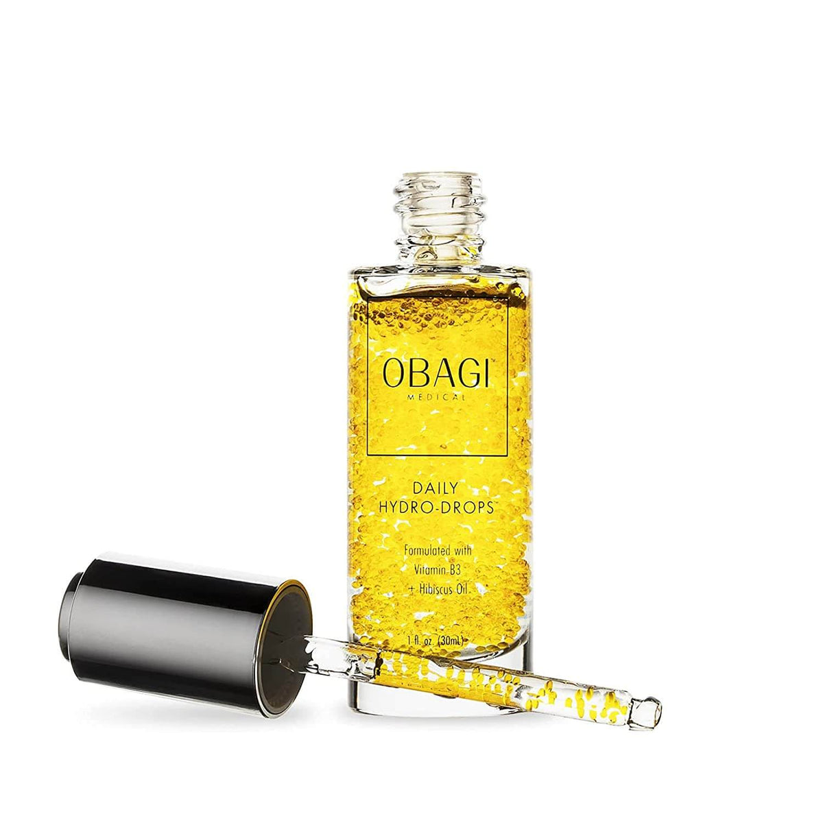 Obagi Daily Hydro-Drops open bottle with dropper shows golden Vitamin B3 and Hibiscus oil serum pearls for hydration daily..
