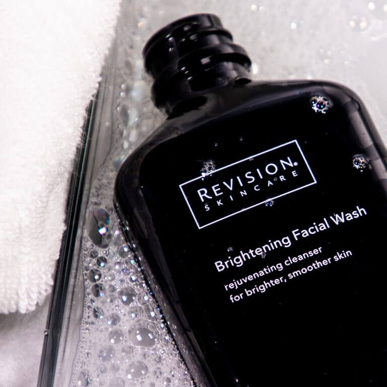 Revision Skincare Brightening Facial Wash gently exfoliates removes impurities and helps reveal smoother clearer radiant skin