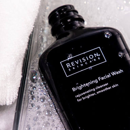 Revision Skincare Brightening Facial Wash gently exfoliates removes impurities and helps reveal smoother clearer radiant skin