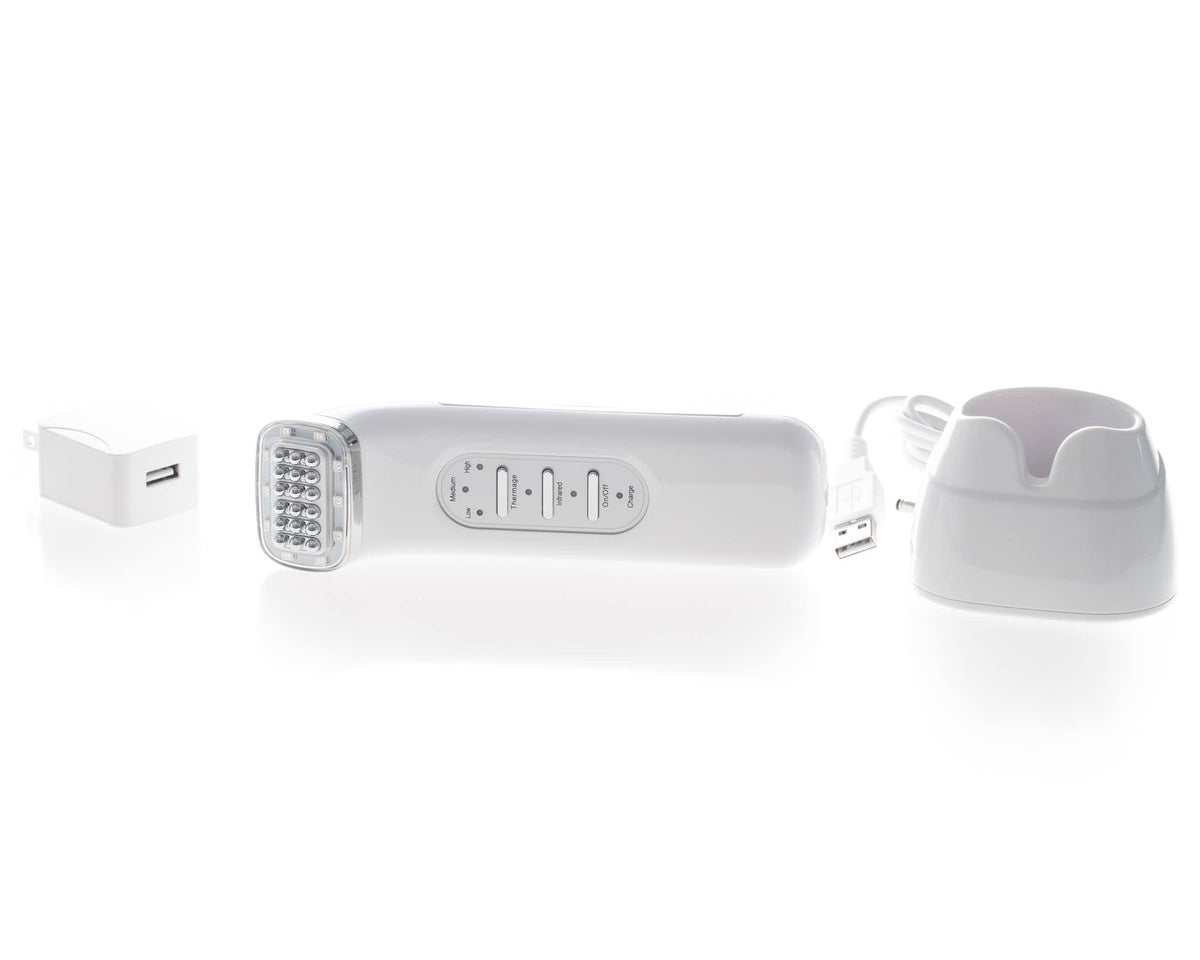 Saian FirmAge Portable RF device laid with charger and cradle for portable face and body toning treatments during travel use