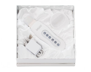 Saian Skin Scrubber Spatula kit includes device, charger, and cradle for ultrasonic exfoliation and enhanced serum use care.