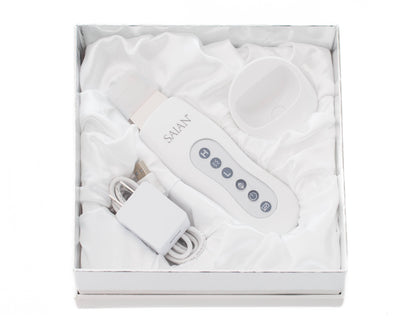 Saian Skin Scrubber Spatula kit includes device, charger, and cradle for ultrasonic exfoliation and enhanced serum use care.