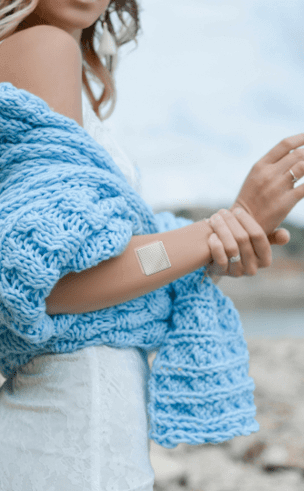 SculptPatch patch worn on arm in a lifestyle setting supporting energy levels and body shaping routine