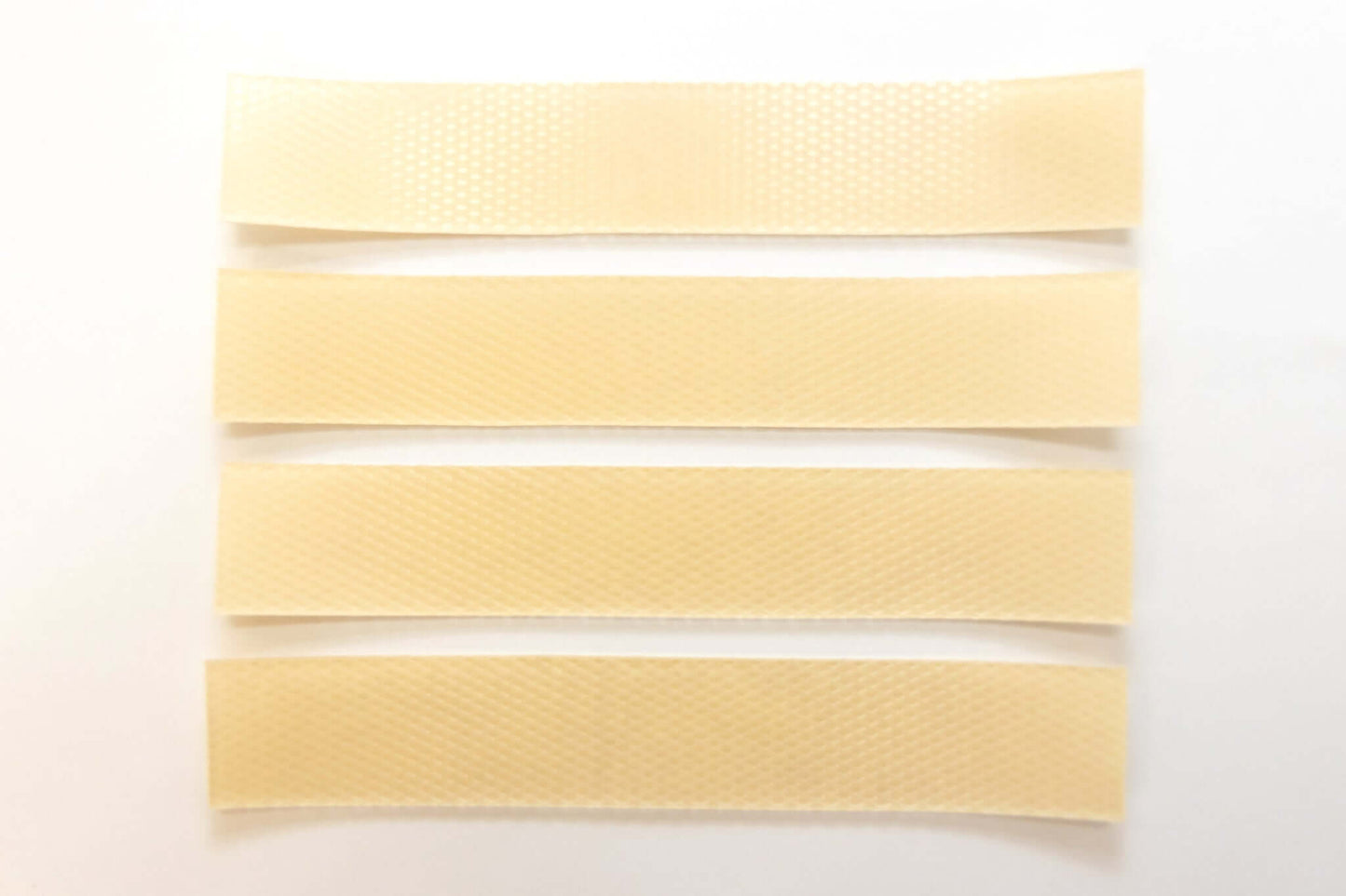 Silagen beige strips laid flat showing narrow beige silicone sheets designed for long narrow scar coverage