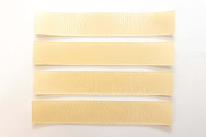 Silagen beige strips laid flat showing narrow beige silicone sheets designed for long narrow scar coverage