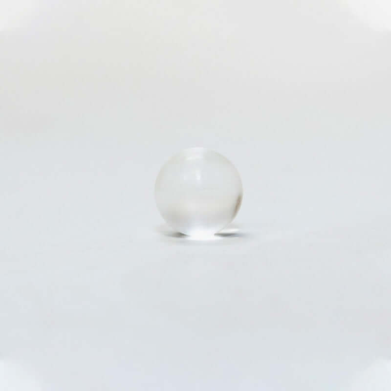 Silagen umbilical sphere shown on white background, a medical-grade silicone sphere designed for belly button scar coverage.