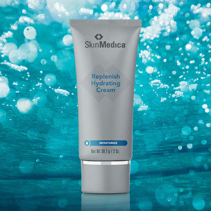SkinMedica Replenish Hydrating Cream tube on blue water background showing moisture support for dry, dehydrated skin now use