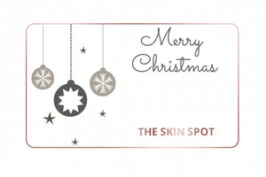 The Skin Spot Christmas gift card with ornaments and holiday design for festive skincare gifting and beauty shopping online.