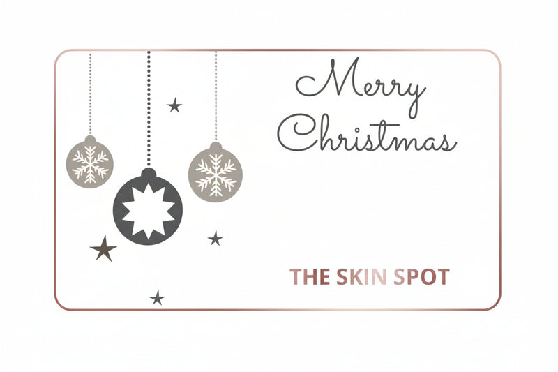 The Skin Spot Christmas gift card with ornaments and holiday design for festive skincare gifting and beauty shopping online.